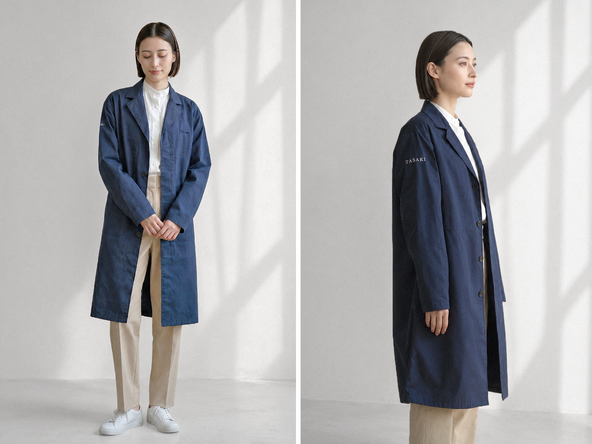 タサキのユニフォームを着用した女性スタッフ。ネイビーのショップコートを着用。