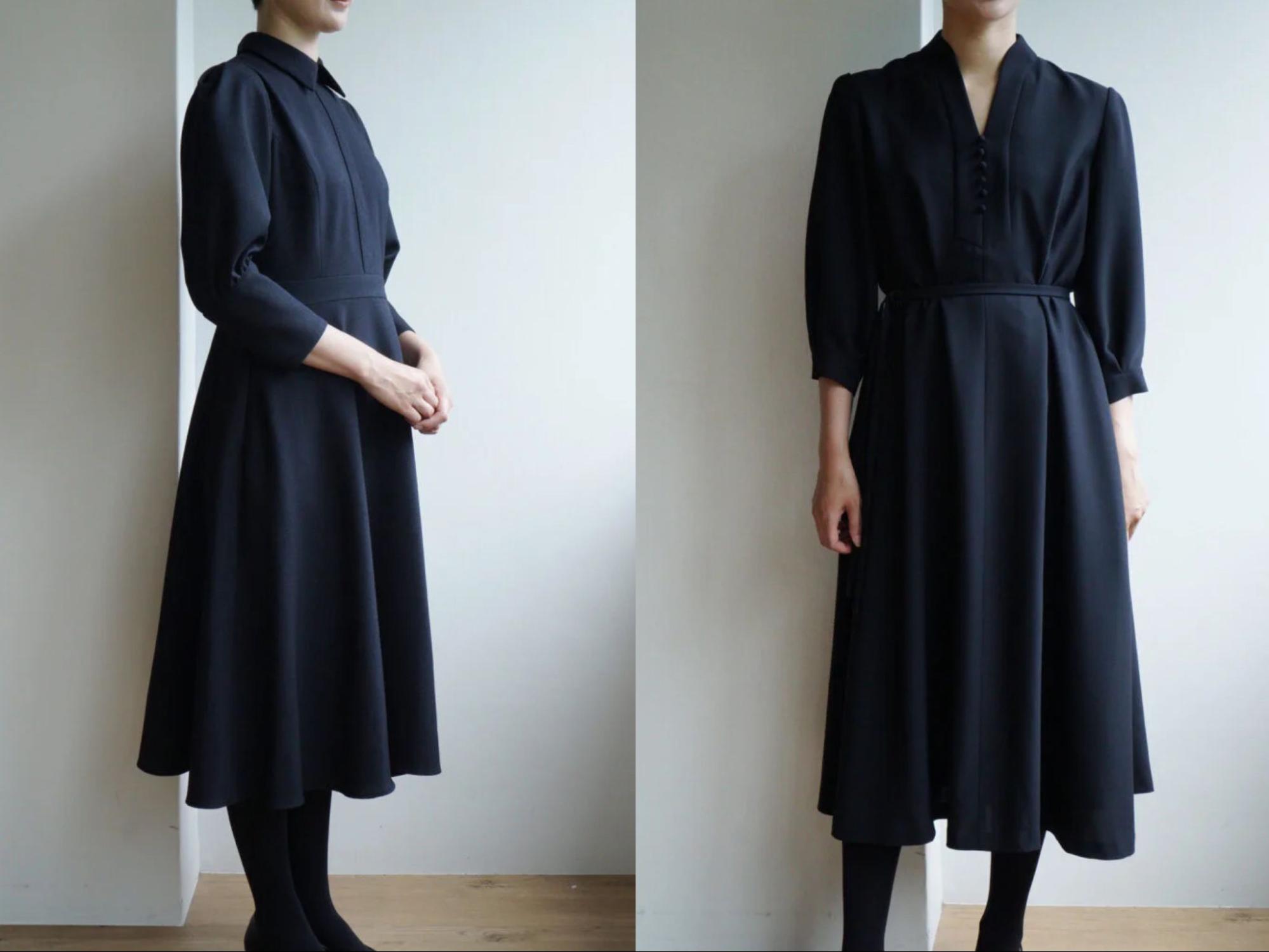 ネイビーのワンピースを着用した女性スタッフ